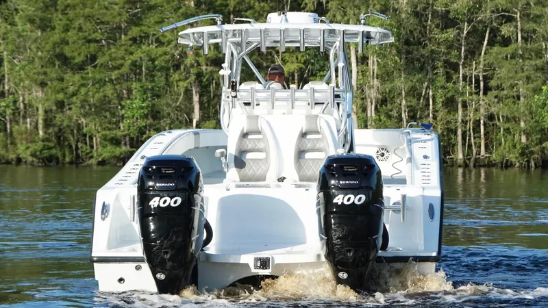 Slide: The Image of 2023 Freeman 34VH boat with dual 400 horsepower engines on a lake. - 3