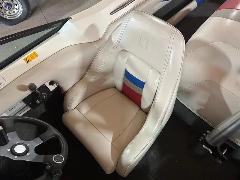 Slide: The Image of 1993 MasterCraft ProStar 190 interior with white seat and steering wheel. - 11