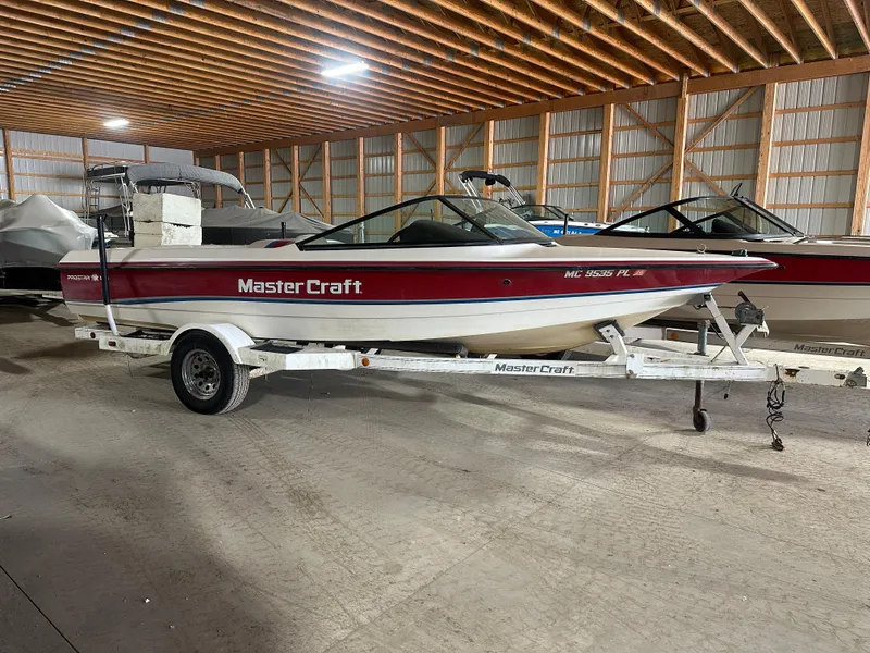 Slide: The Image of 1993 MasterCraft ProStar 190 boat on trailer in storage facility. - 3