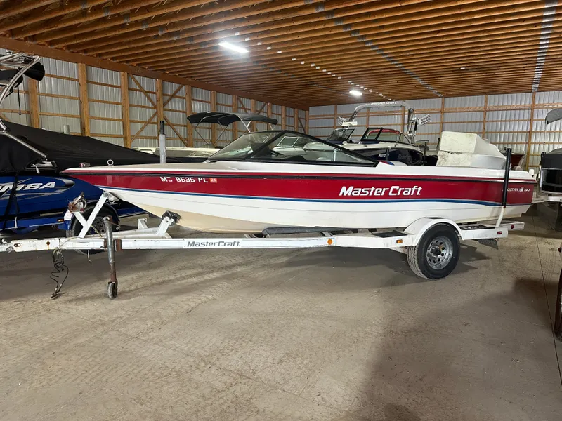 Slide: The Image of 1993 MasterCraft ProStar 190 boat on trailer in storage facility. - 4