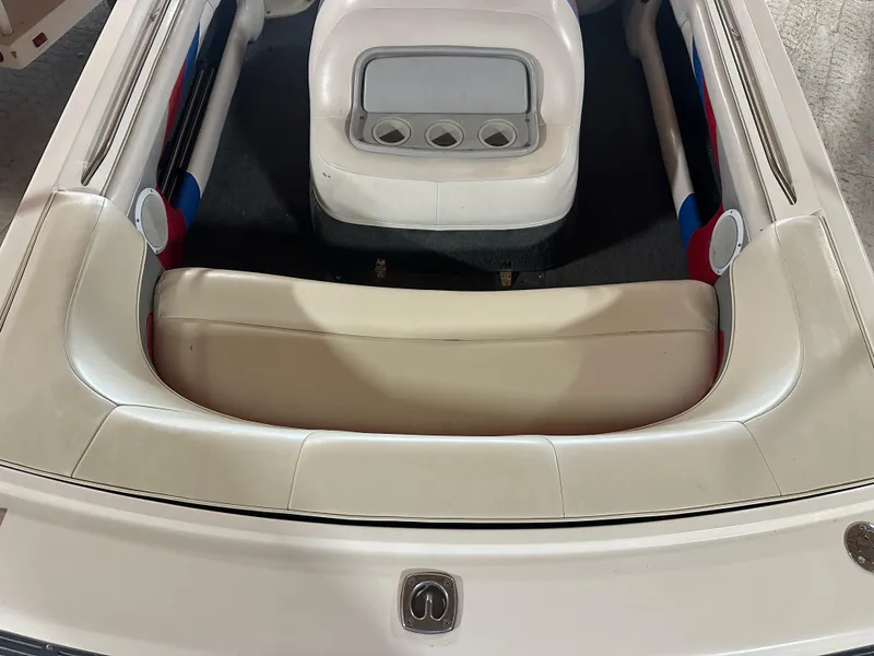 Slide: The Image of 1993 MasterCraft ProStar 190 boat interior with white seating and cup holders. - 7