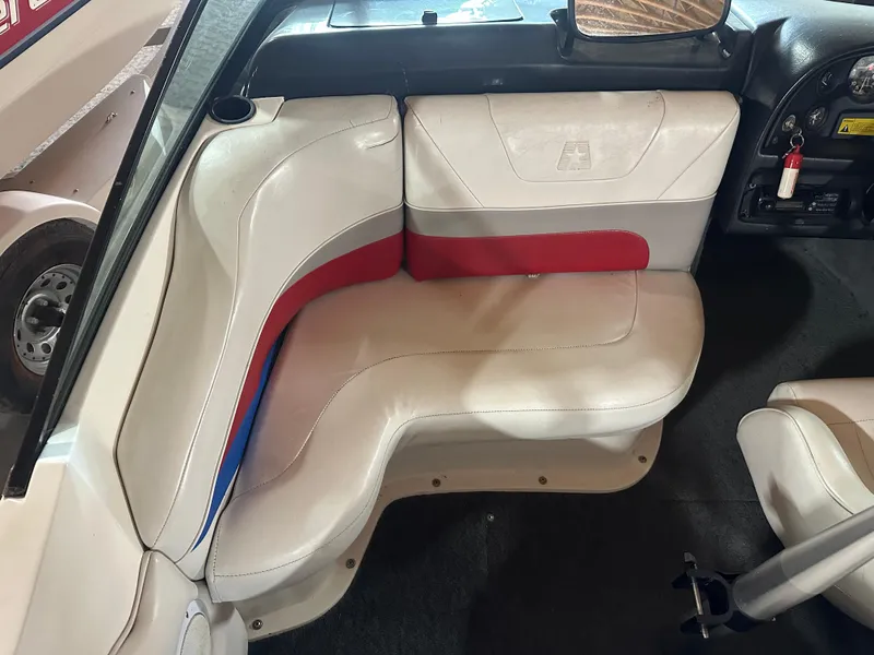 Slide: The Image of 1993 MasterCraft ProStar 190 interior with white and red seating, dashboard, and steering wheel. - 9