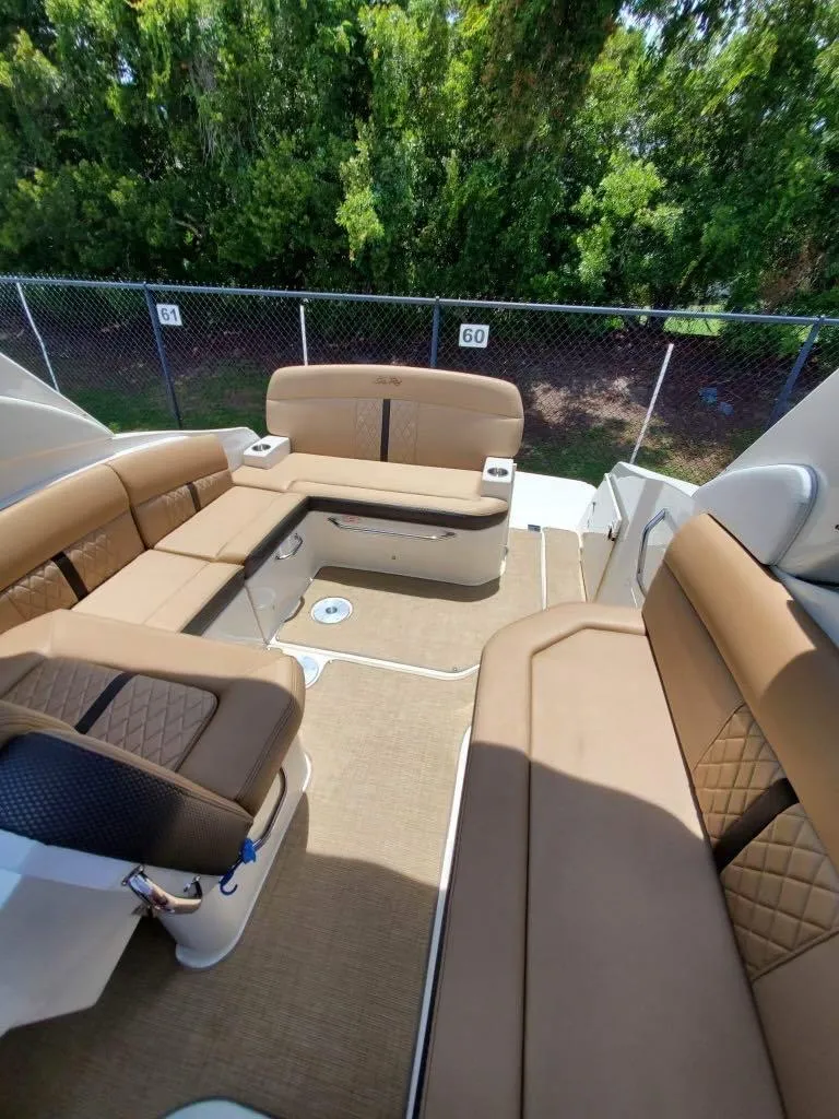Slide: The Image of Interior of 2017 Sea Ray 260 Sundancer with tan seating and spacious layout. - 5