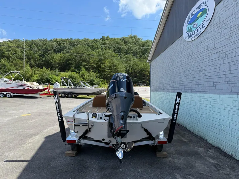Slide: The Image of 2026 Xpress H20 Bass boat with Yamaha engine, parked outside Water Works Marine. - 7