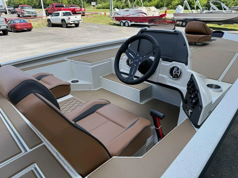 Slide: The Image of 2026 Xpress H20 Bass boat interior with tan seats and modern steering console. - 8