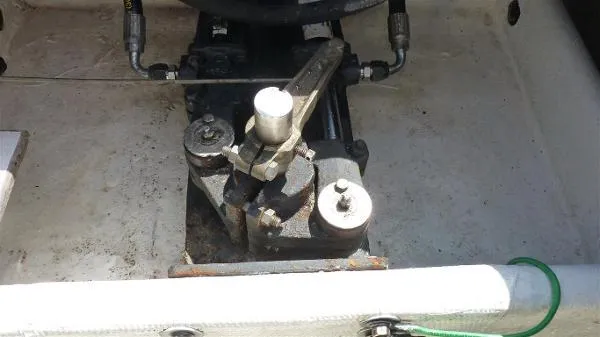 Slide: The Image of Engine compartment of a 1987 Duffy Flybridge Cruiser, showing mechanical components and hydraulic lines. - 37