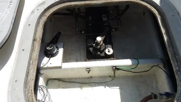 Slide: The Image of Engine compartment of a 1987 Duffy Flybridge Cruiser, showing mechanical components and wiring. - 38