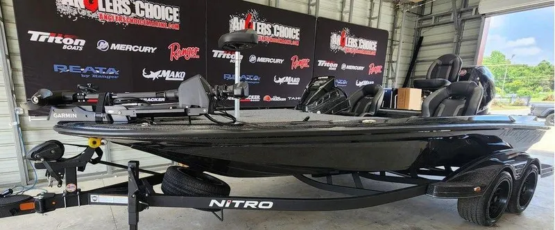 The Image of 2026 Nitro Z20 XL Pro boat in showroom, featuring sleek black design and advanced equipment. - 1