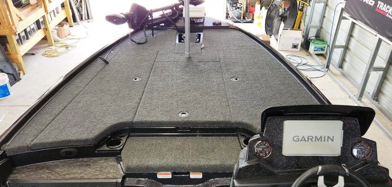 Slide: The Image of 2026 Nitro Z20 XL Pro boat interior with Garmin navigation system in a garage setting. - 10