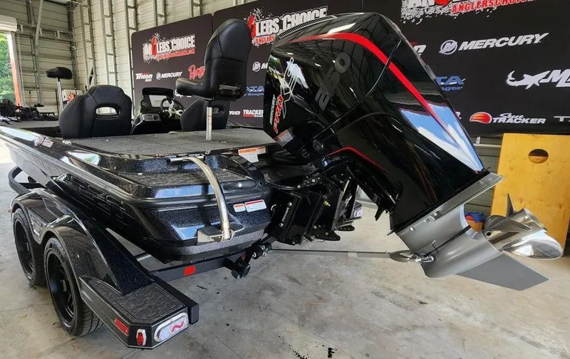 Slide: The Image of 2026 Nitro Z20 XL Pro boat with powerful outboard motor in a showroom setting. - 3