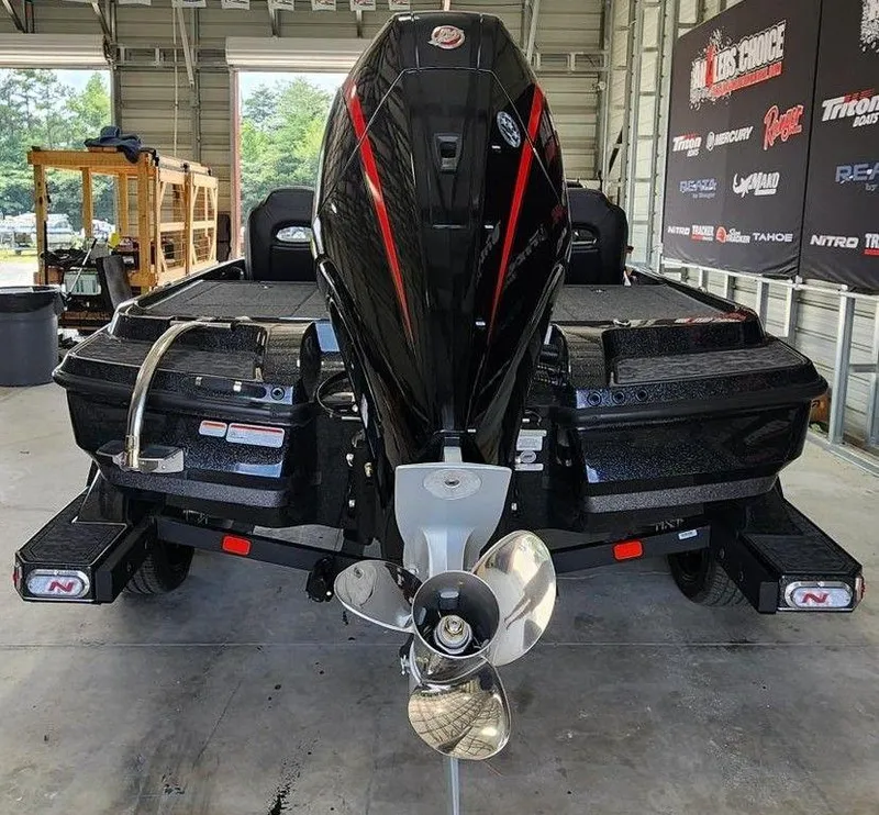 Slide: The Image of 2026 Nitro Z20 XL Pro boat in a garage, showcasing its powerful engine and sleek design. - 4