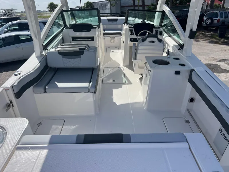 Slide: The Image of 2025 Robalo R257 Dual Console boat interior with seating and helm station. - 7