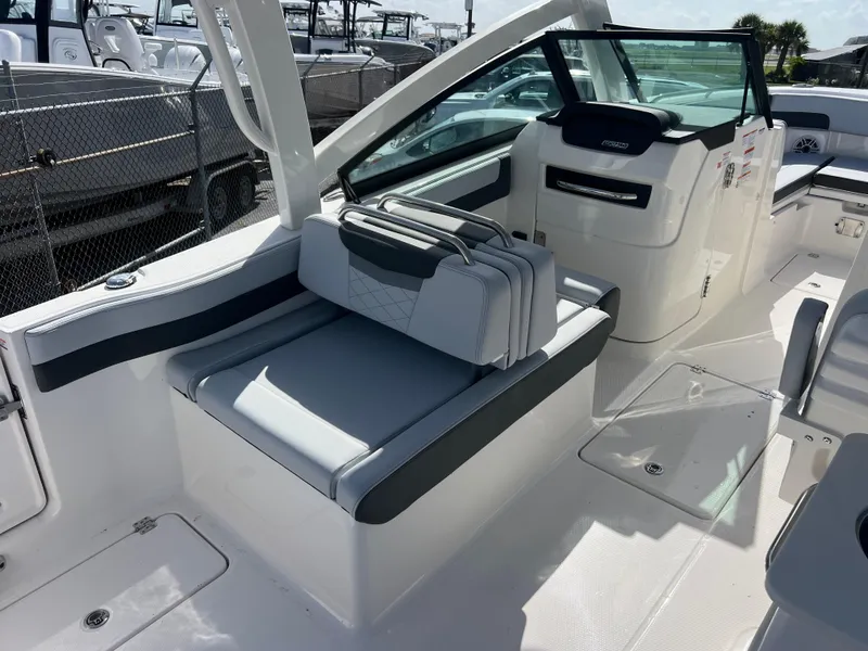 Slide: The Image of 2025 Robalo R257 Dual Console boat interior with sleek seating and modern design. - 8
