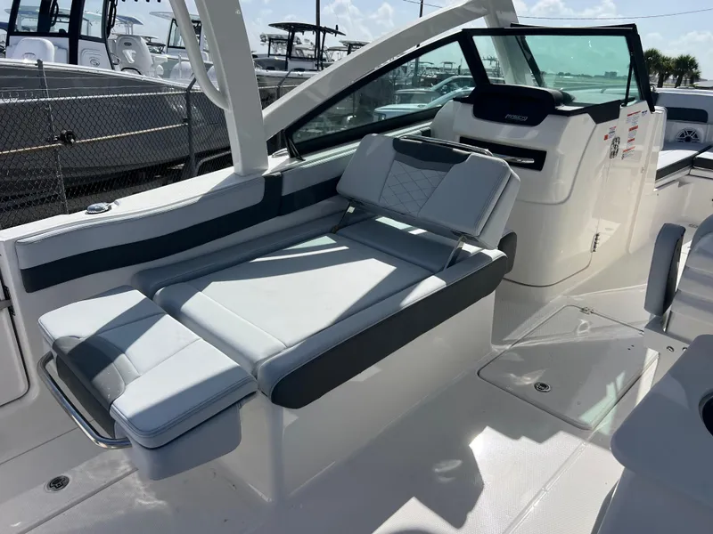 Slide: The Image of 2025 Robalo R257 Dual Console boat interior with sleek seating and modern design. - 9
