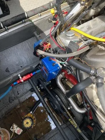 Slide: The Image of Engine compartment of a 1988 Donzi R23 boat, showing wiring and components. - 6