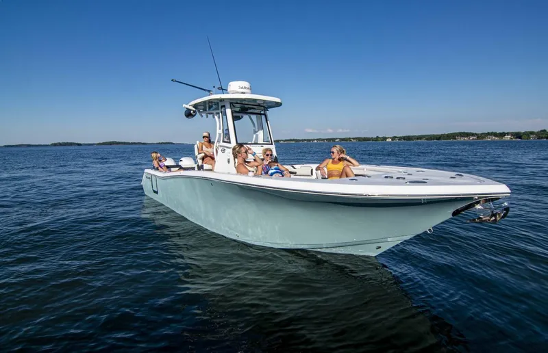 Slide: The Image of 2026 Tidewater 272 LXF boat with passengers enjoying a sunny day on the water. - 5