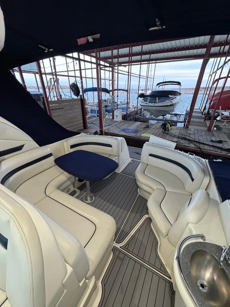 Slide: The Image of 2007 Sea Ray 38 Sundancer yacht on calm water, clear sky background. - 15