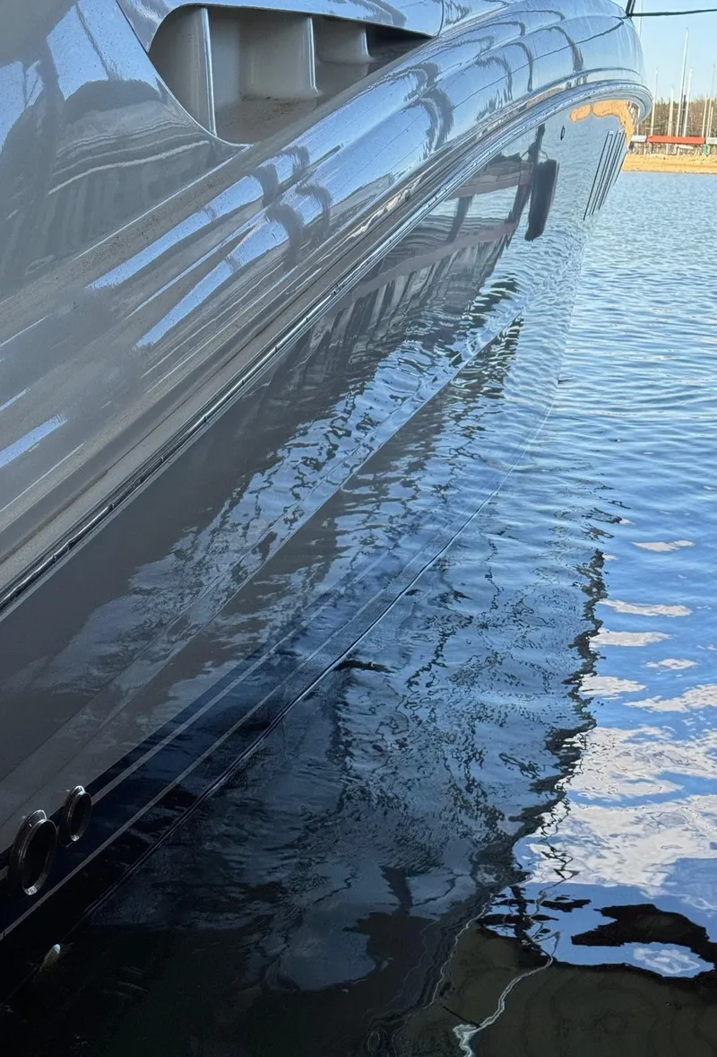 Slide: The Image of 2007 Sea Ray 38 Sundancer yacht cruising on calm waters under clear skies. - 17