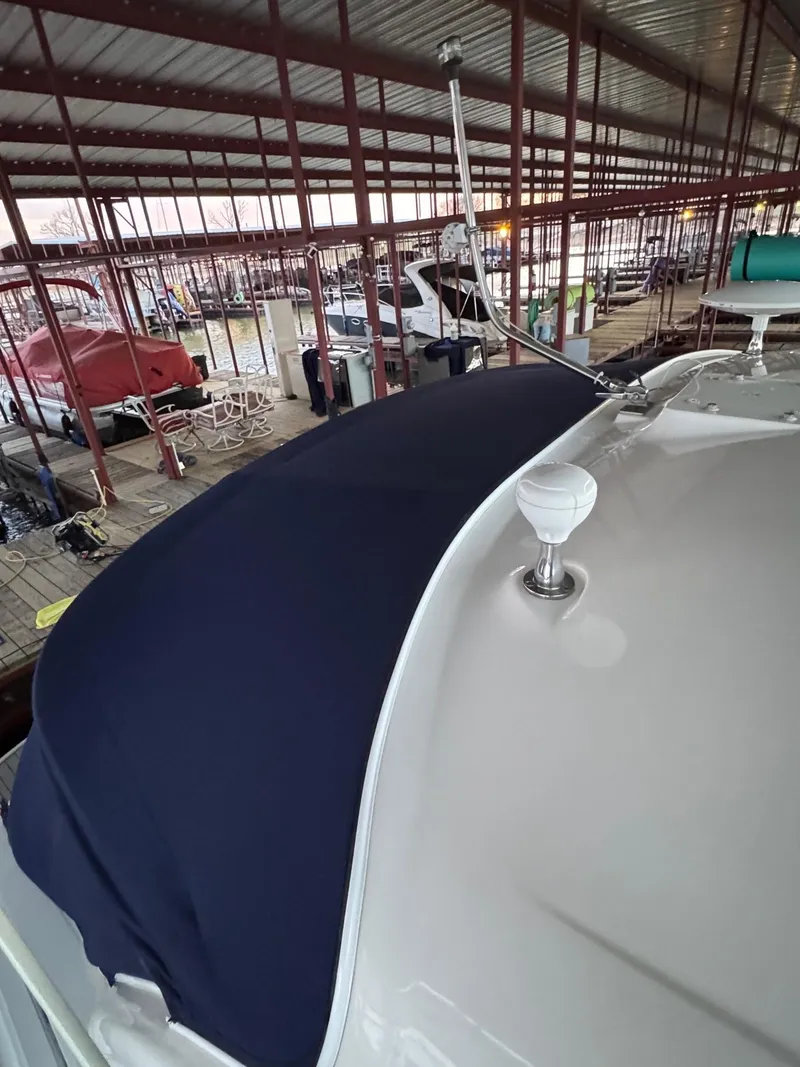 Slide: The Image of 2007 Sea Ray 38 Sundancer in covered marina, featuring sleek design and modern equipment. - 26