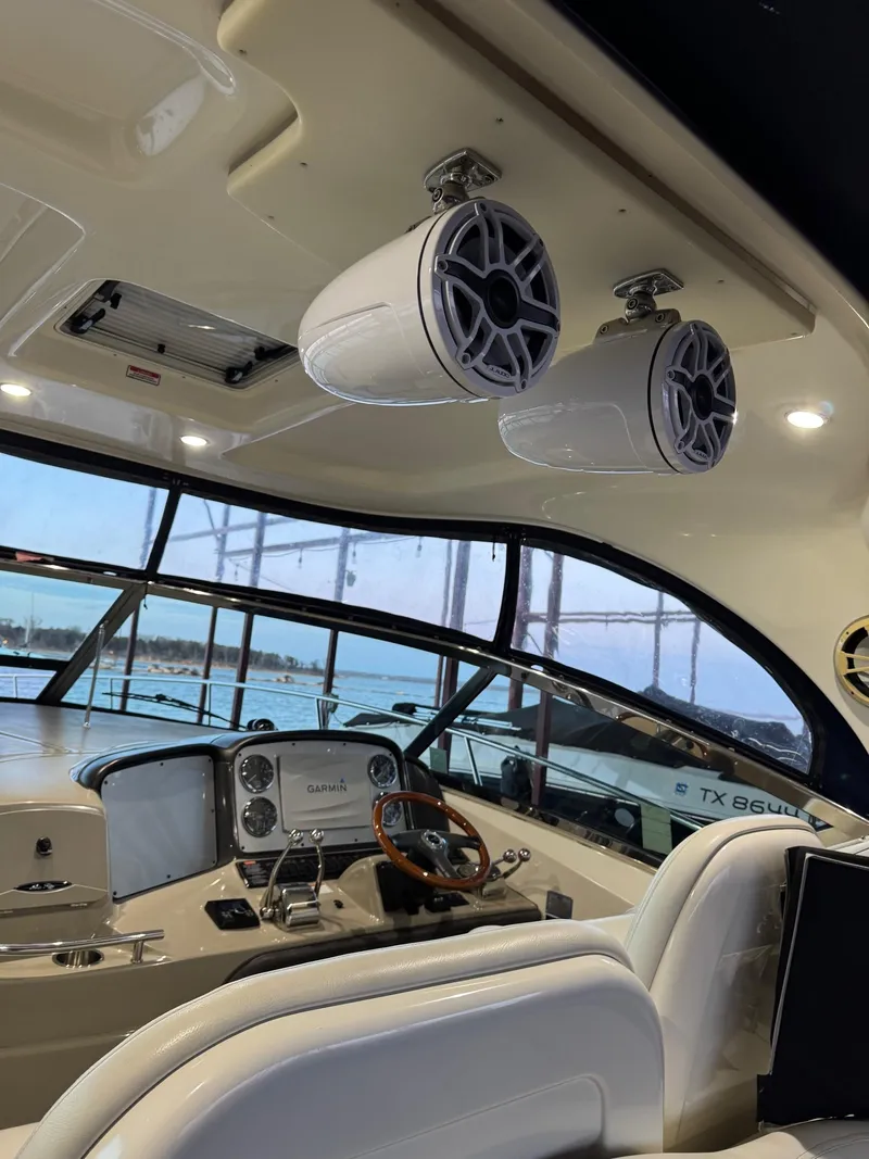 Slide: The Image of Interior of 2007 Sea Ray 38 Sundancer yacht with speakers and steering wheel. - 32
