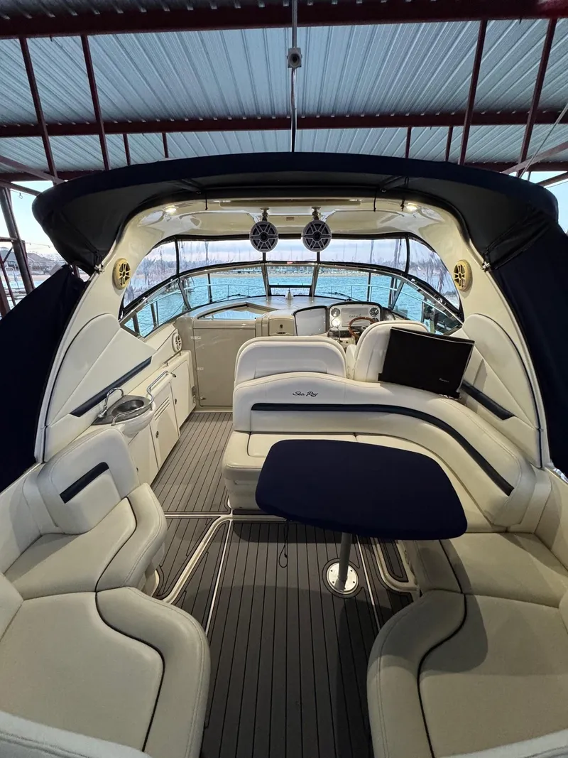 Slide: The Image of Interior of a 2007 Sea Ray 38 Sundancer yacht with luxurious seating and helm. - 34