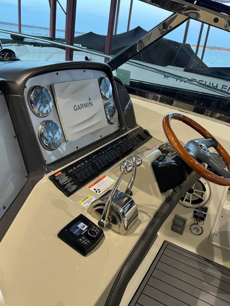 Slide: The Image of 2007 Sea Ray 38 Sundancer boat named "Lucky 9" on calm water, rear view. - 6