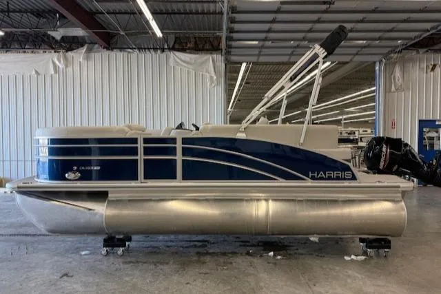 The Image of 2025 Harris CR190 pontoon boat in a warehouse setting. - 1