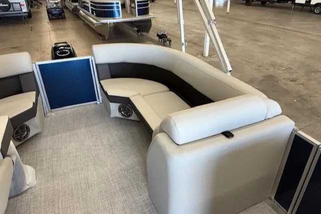 Slide: The Image of 2025 Harris CR190 pontoon boat interior with beige seating and modern design. - 14