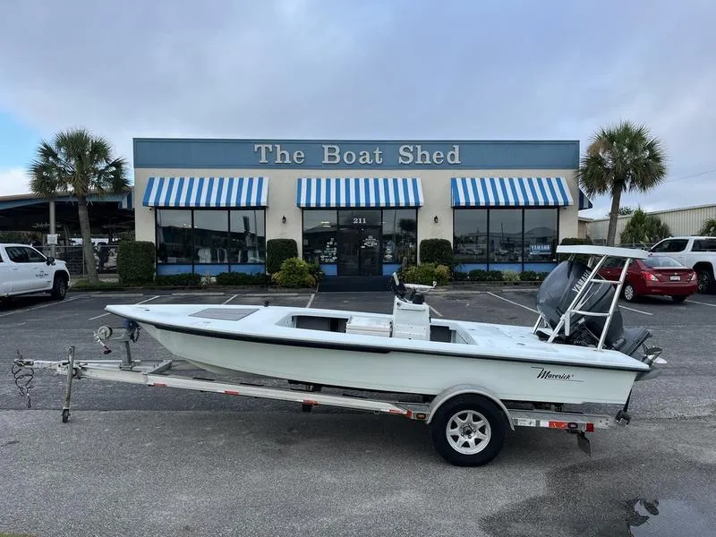 Slide: The Image of 2009 Maverick HPX-V boat on trailer outside The Boat Shed store. - 1