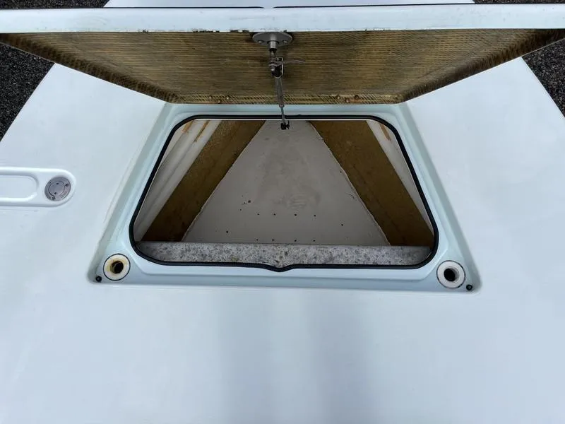 Slide: The Image of Open storage compartment on a 2009 Maverick HPX-V boat. - 11