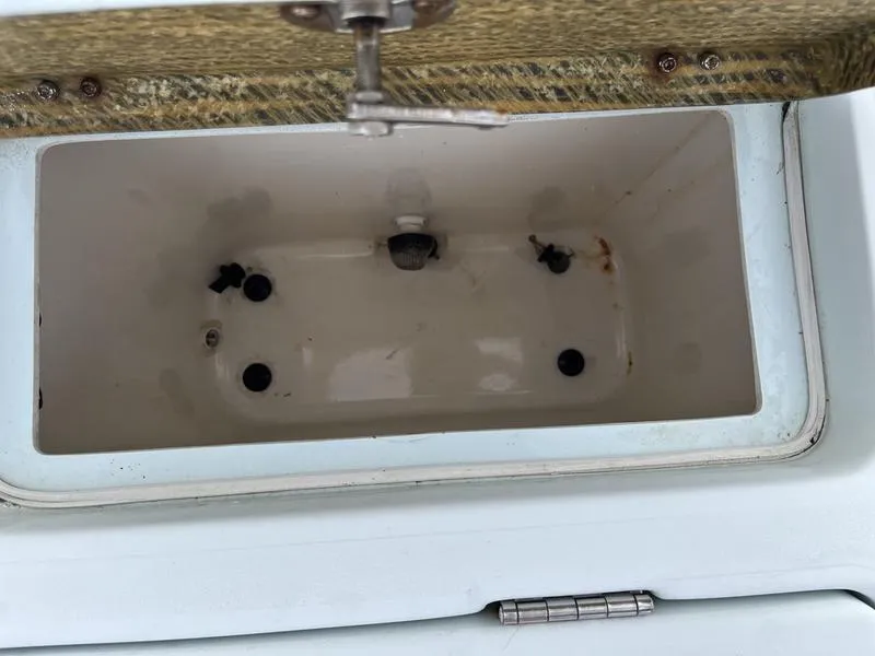 Slide: The Image of Open storage compartment in 2009 Maverick HPX-V boat. - 13