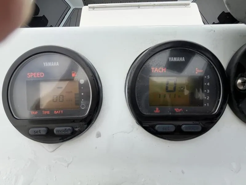 Slide: The Image of Yamaha speed and tachometer gauges on 2009 Maverick HPX-V boat dashboard. - 14