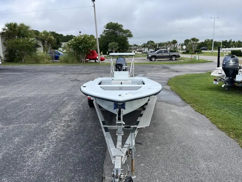 Slide: The Image of 2009 Maverick HPX-V boat on trailer in parking lot, overcast sky. - 3