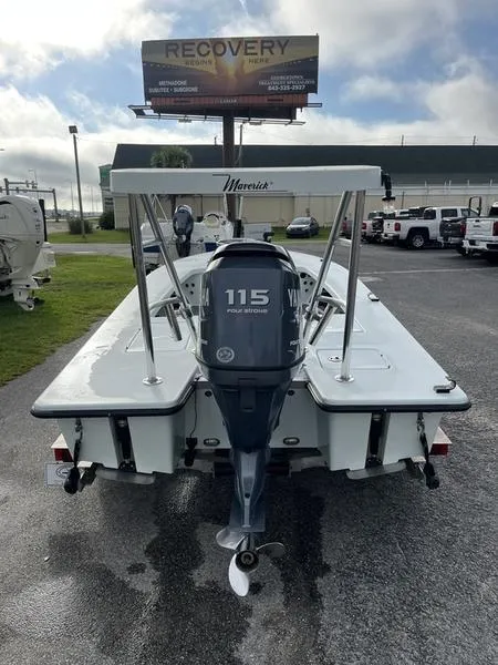 Slide: The Image of 2009 Maverick HPX-V boat with 115 horsepower engine, parked outdoors. - 5