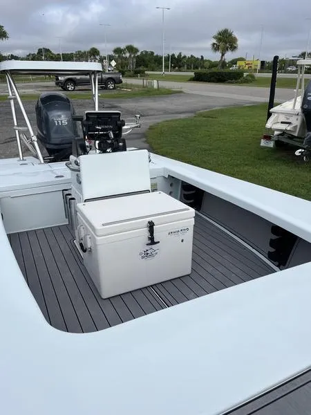 Slide: The Image of 2009 Maverick HPX-V boat interior with cooler and Yamaha outboard motor. - 8