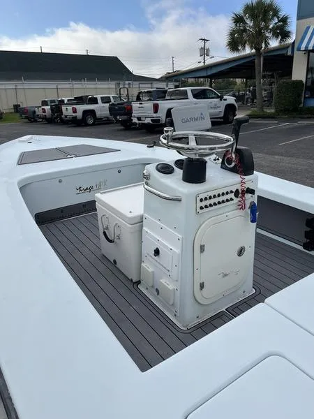 Slide: The Image of 2009 Maverick HPX-V boat with Garmin equipment, parked in a lot. - 9