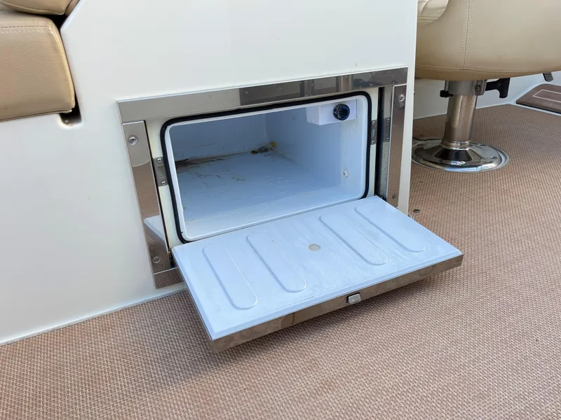 Slide: The Image of Open storage compartment on 2015 Chris-Craft 32 Launch boat interior. - 21