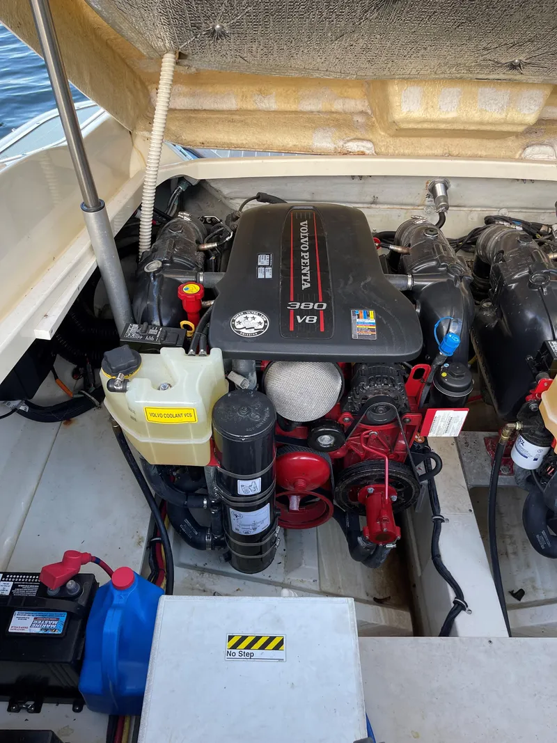 Slide: The Image of Engine compartment of a 2015 Chris-Craft 32 Launch boat, featuring a powerful V8 engine. - 28