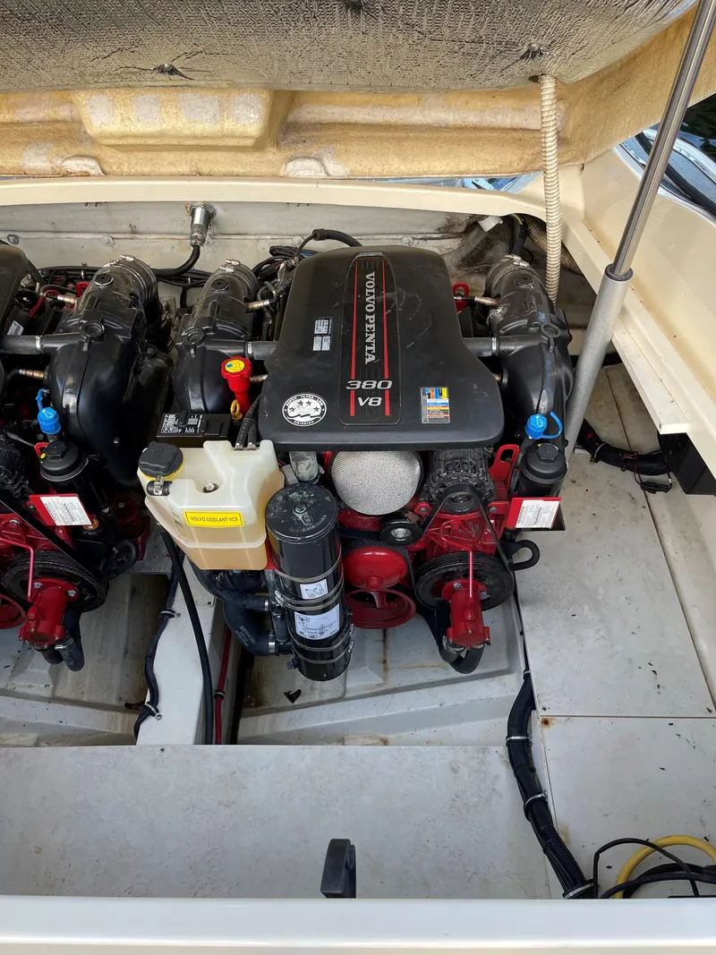 Slide: The Image of Engine compartment of a 2015 Chris-Craft 32 Launch boat, featuring dual engines. - 29