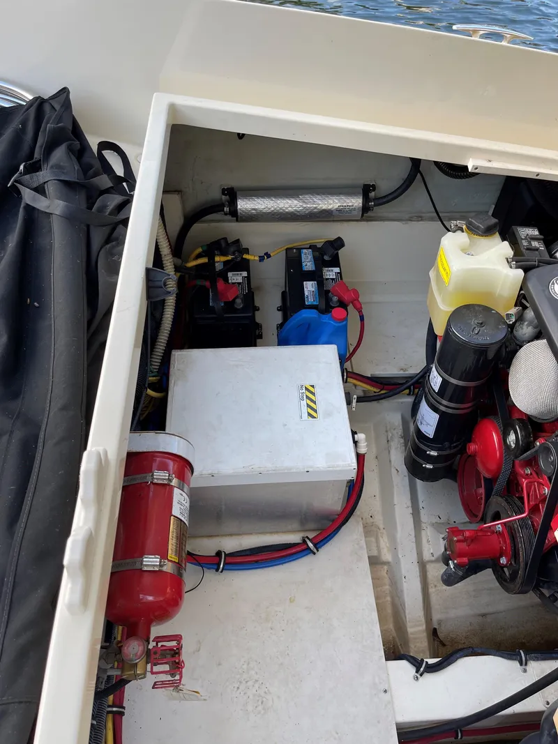 Slide: The Image of Engine compartment of a 2015 Chris-Craft 32 Launch, showing mechanical components and wiring. - 31