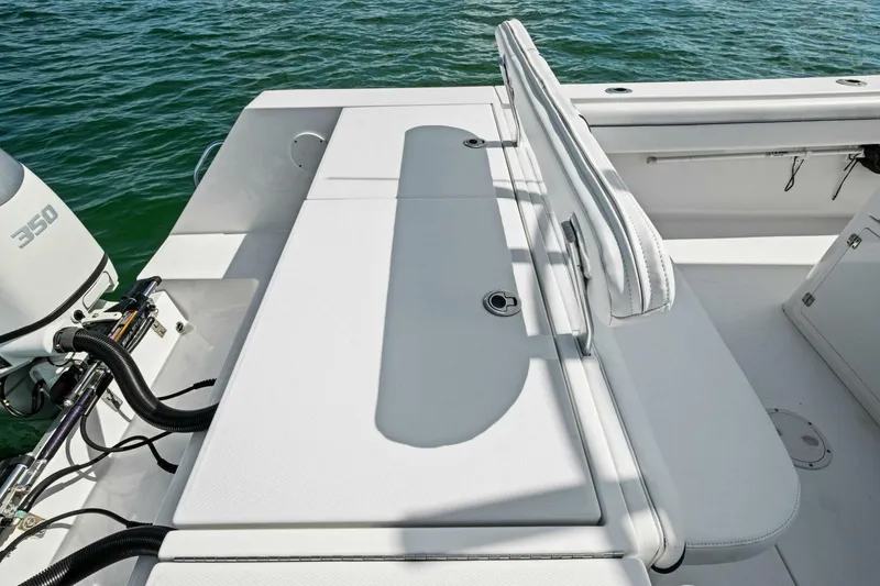 Slide: The Image of 2012 Regulator 32 FS boat with seating and 350 engine on calm water. - 20