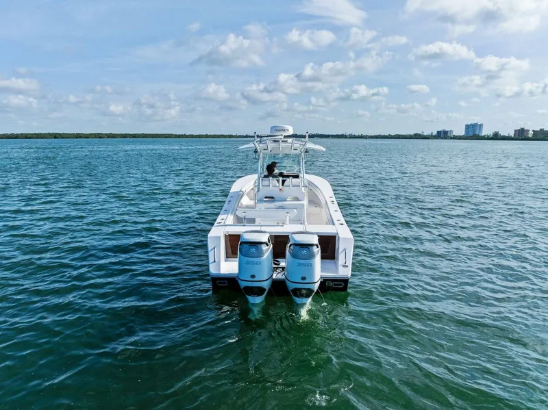Slide: The Image of 2012 Regulator 32 FS boat on open water with twin engines. - 29