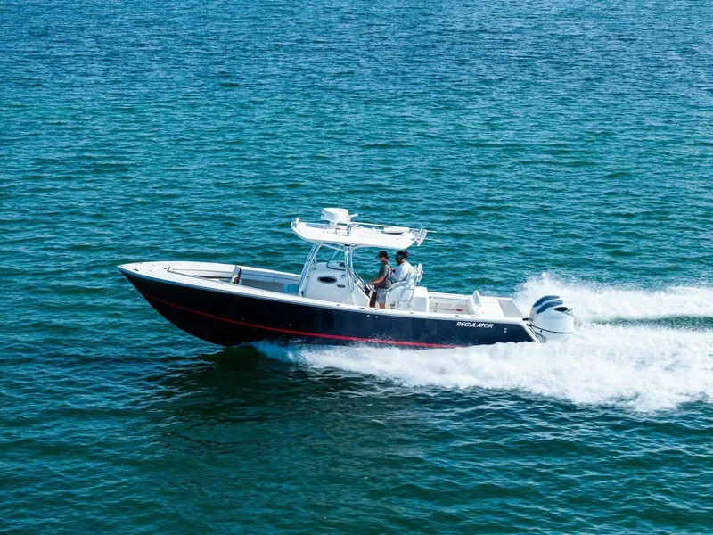 Slide: The Image of 2012 Regulator 32 FS boat cruising on open water. - 33