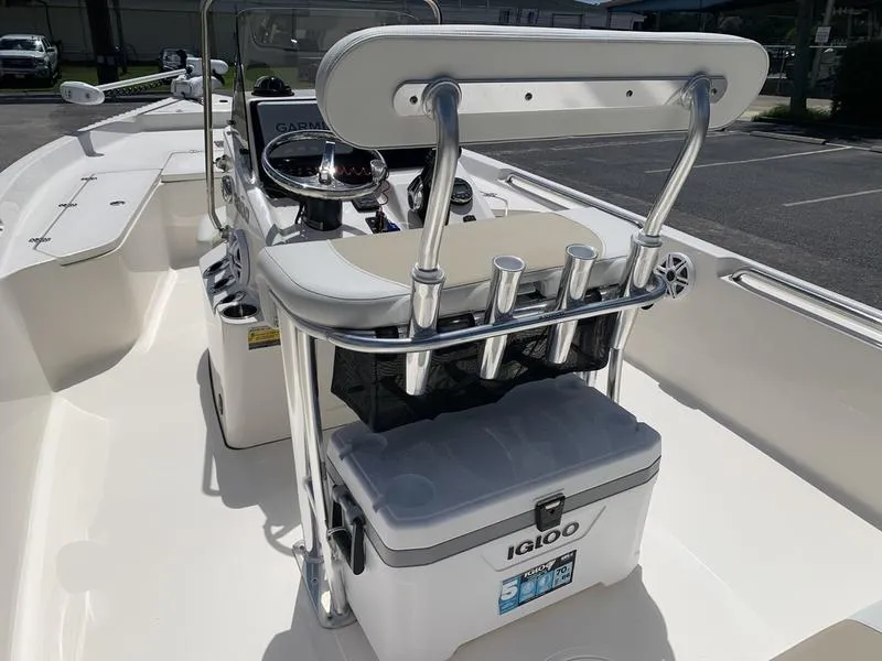Slide: The Image of 2025 Bulls Bay 2200 boat interior with Igloo cooler and rod holders. - 12