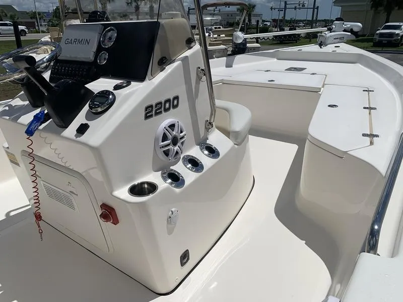 Slide: The Image of 2025 Bulls Bay 2200 boat interior with Garmin system and cup holders. - 17