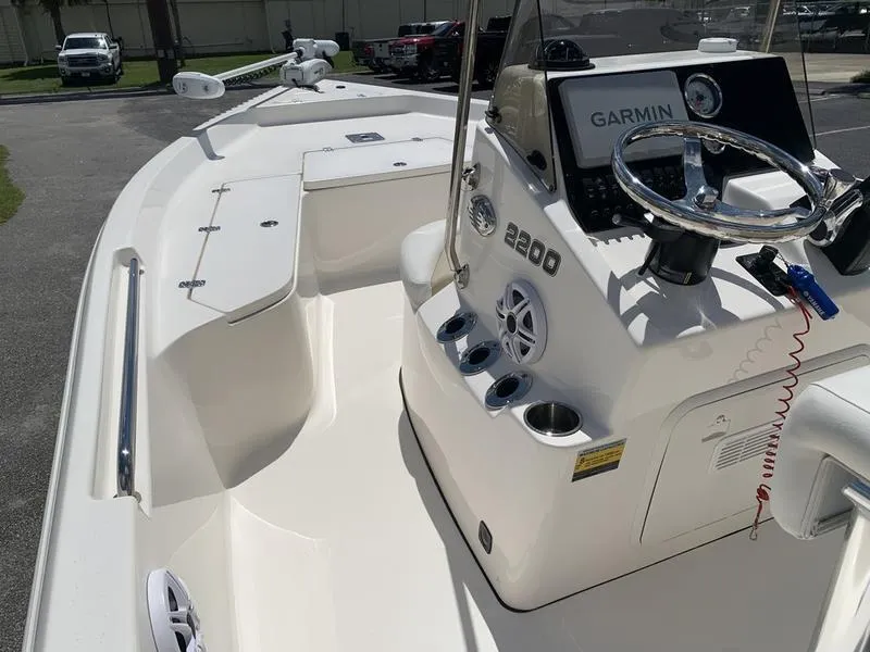 Slide: The Image of 2025 Bulls Bay 2200 boat interior with Garmin navigation system and steering wheel. - 18