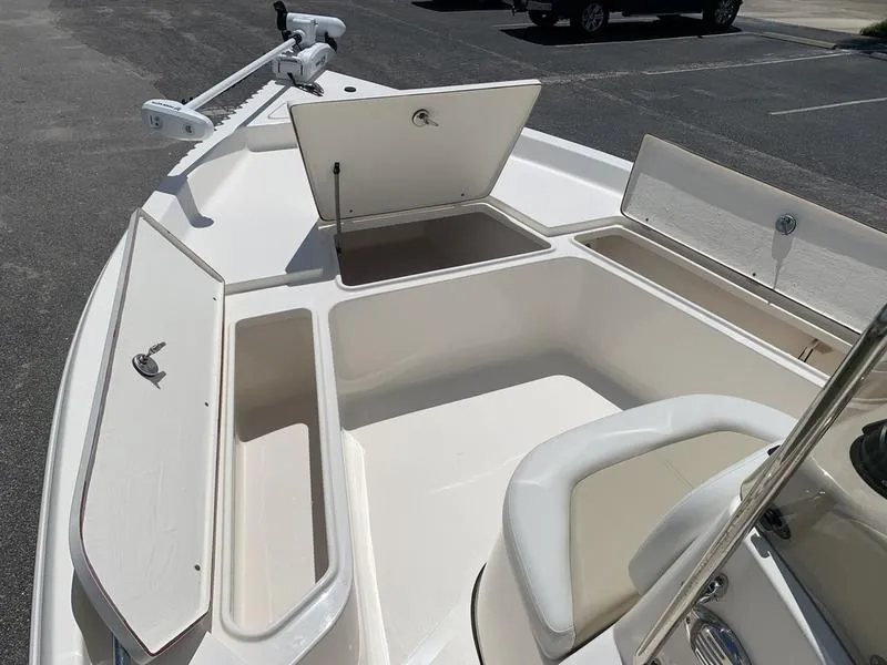 Slide: The Image of 2025 Bulls Bay 2200 boat with open storage compartments and seating. - 20