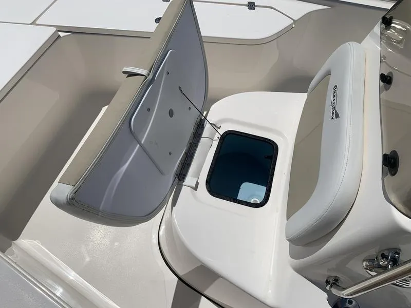 Slide: The Image of 2025 Bulls Bay 2200 boat interior with open storage compartment and seating. - 23