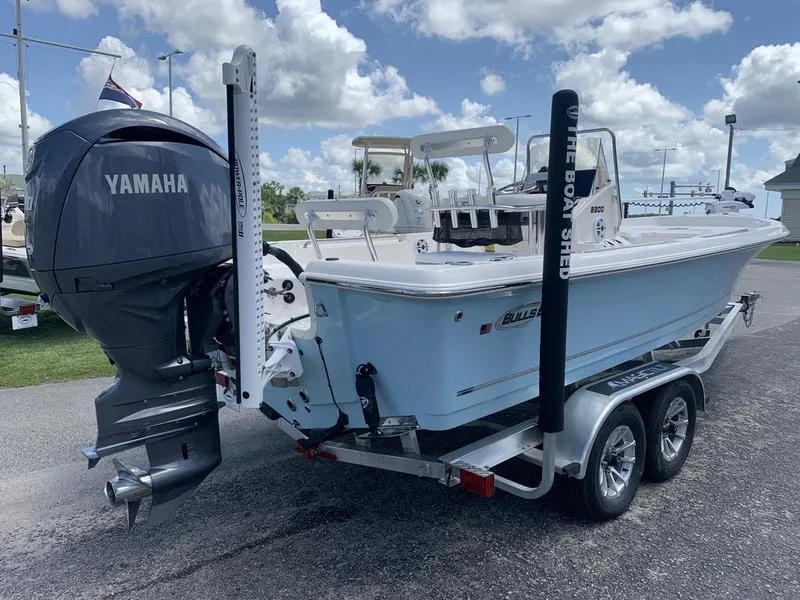Slide: The Image of 2025 Bulls Bay 2200 boat with Yamaha engine on trailer, parked outdoors. - 4