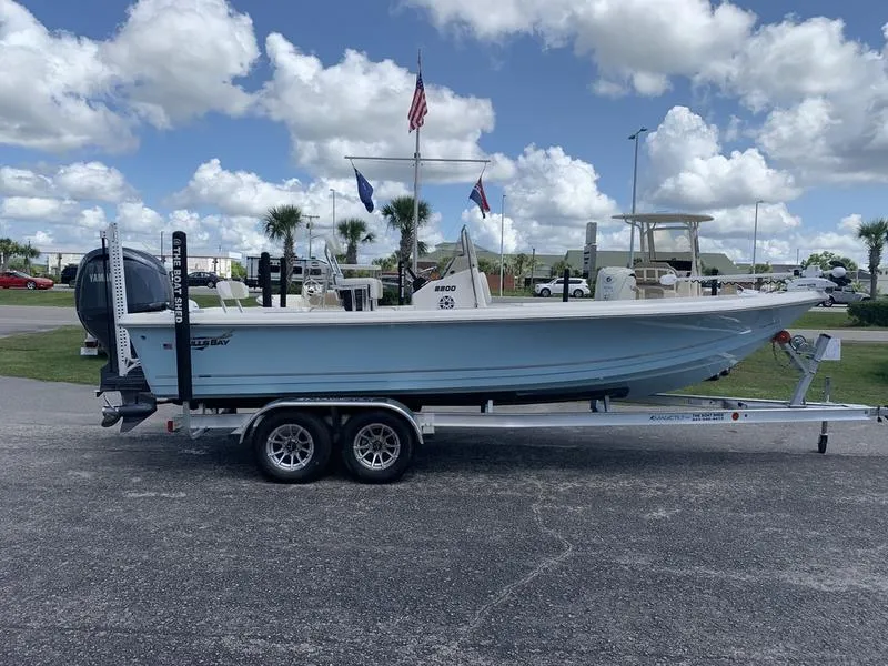 Slide: The Image of 2025 Bulls Bay 2200 boat on trailer under cloudy sky. - 5